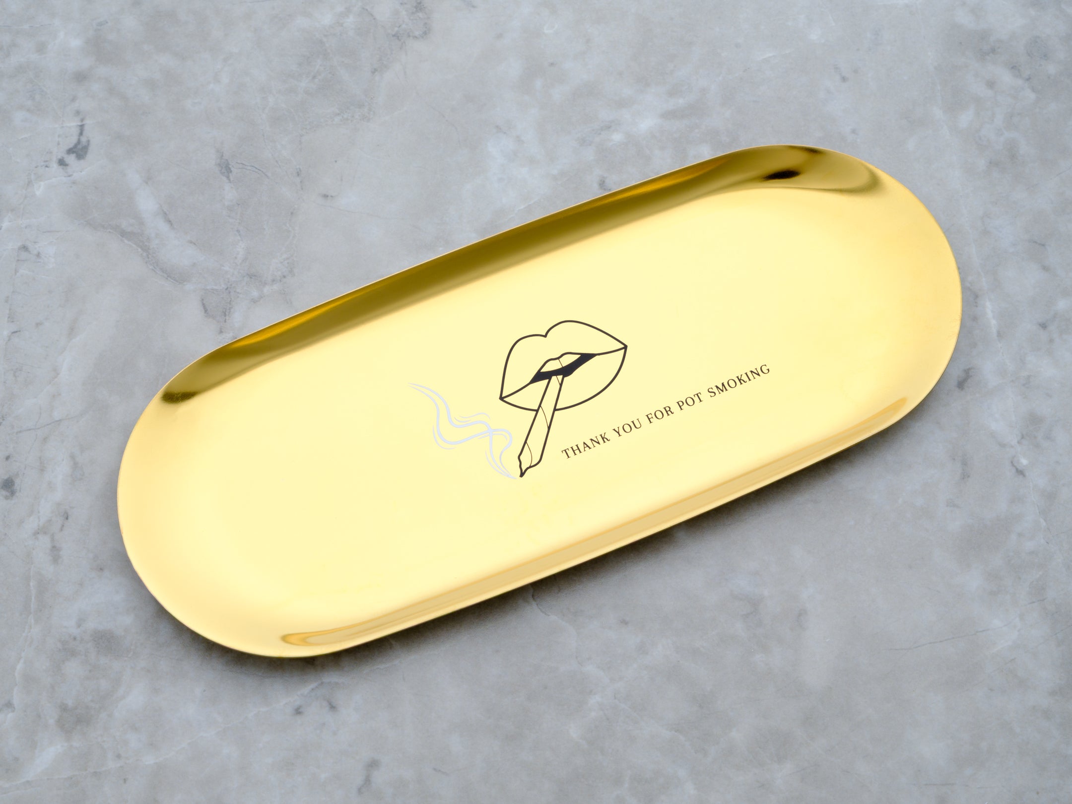 High polish stainless steel rolling tray in a gold finish. The tray features the words Thank you for pot smoking. The graphic is of pouty lips smoking a joint.